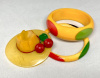 BP157 butterscotch bakelite figural hat pin with red cherries